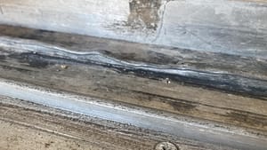 bent sliding door track causing rough movement