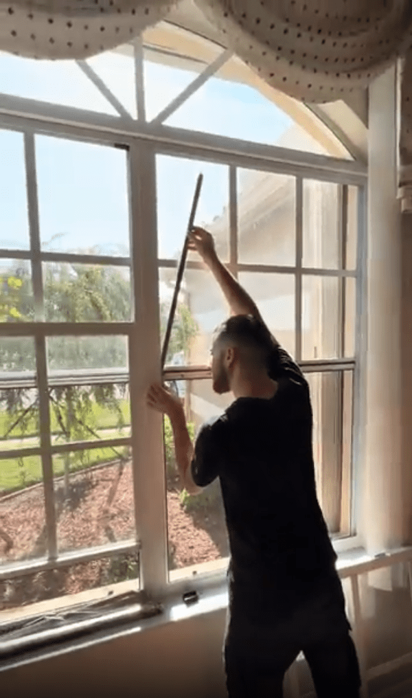 Professional technician working on window repair in Intercession City