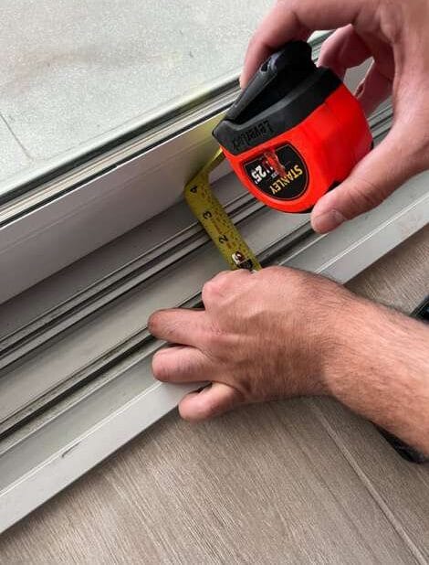 Technician taking track measurement